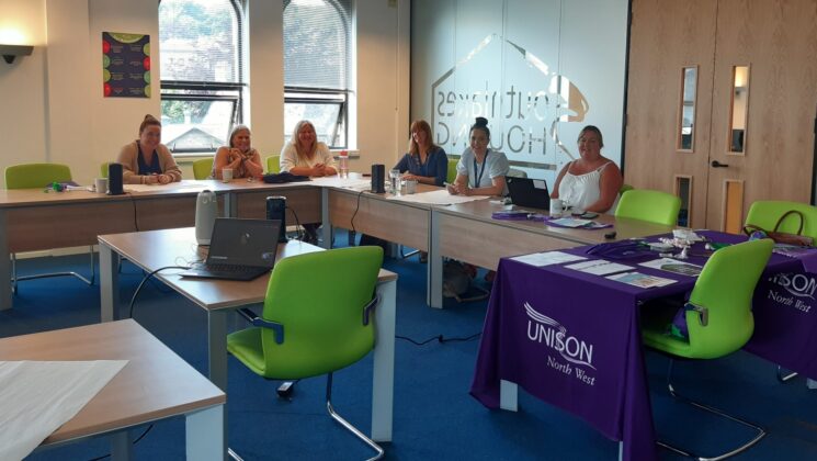 Six women sat around a desk on a UNISON course.