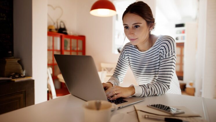 A woman using a laptop computer